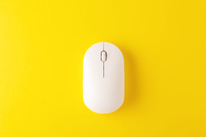 Wireless mouse on yellow background