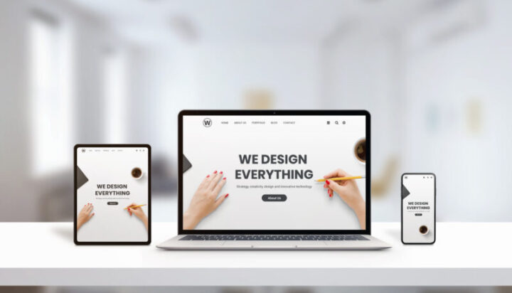 Responsive agency web page on laptop, tablet and phone display concept. Modern, flat web page design. Modern devices with thin edges. Office, studio desk